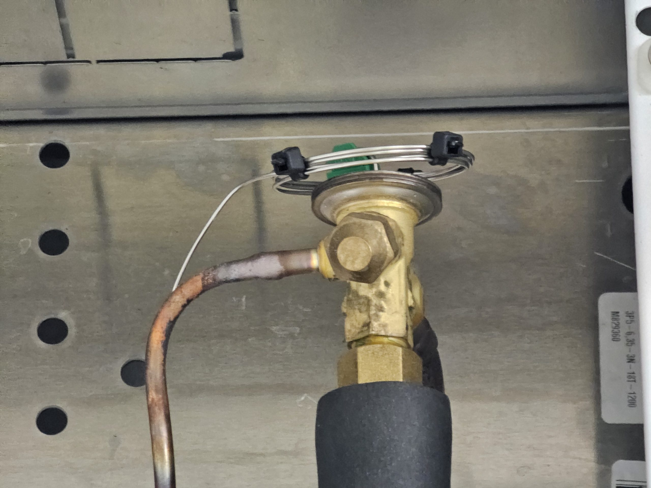Instructor demonstrating A2L refrigerant handling in training course