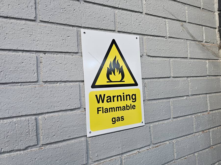 Safety signage indicating precautions in refrigeration services